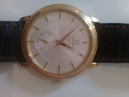 Omega Chronometer 18k Gold with original international warranty and box bought in Geneve 1997